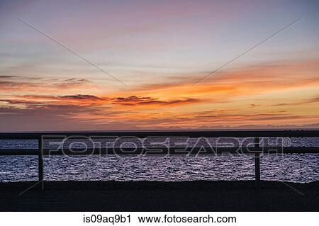 "Silhouetted fence and sea at dusk, Reine, Lofoten, Norway" View Large Photo Image Stock Image - "Silhouetted fence and sea at dusk, Reine, Lofoten, Norway". Fotosearch