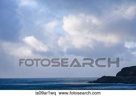 "Silhouetted view of sea cliff and storm clouds, Reine, Lofoten, Norway" View Large Photo Image Stock Photography - "Silhouetted view of sea cliff and storm clouds, Reine, Lofoten, Norway". Fotosearch