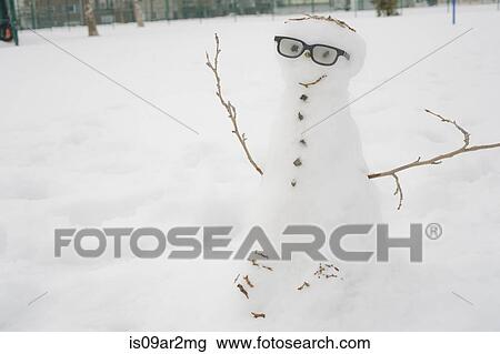 Snowman in snowy landscape View Large Photo Image Stock Image - Snowman in snowy landscape. Fotosearch