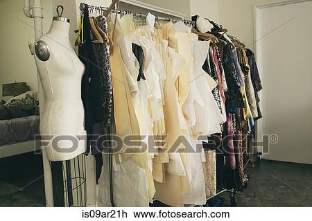 Tailors dummy and clothes rail in fashion studio View Large Photo Image Stock Image - Tailors dummy and clothes rail in fashion studio. Fotosearch