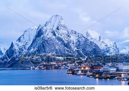 Stock Photograph - "The fishing village of Reine at dusk, Lofoten, Norway". Fotosearch