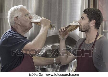Two brewers drinking beer in the brewery View Large Photo Image Stock Image - Two brewers drinking beer in the brewery. Fotosearch