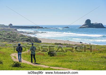 "Two young male friends walking coastal path, Big Sur, California, USA" View Large Photo Image Stock Photography - "Two young male friends walking coastal path, Big Sur, California, USA". Fotosearch