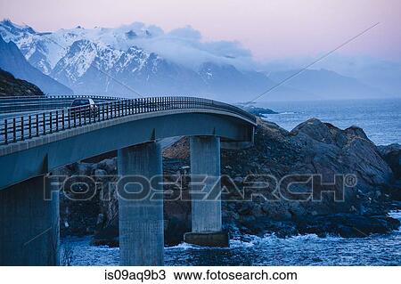 "Vehicle crossing coastal bridge at dusk, Reine, Lofoten, Norway" View Large Photo Image Stock Image - "Vehicle crossing coastal bridge at dusk, Reine, Lofoten, Norway". Fotosearch