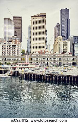 Stock Image - "View of waterfront with Columbia Centre and Henry M Jackson Federal buildings, Seattle, Washington State, USA". Fotosearch
