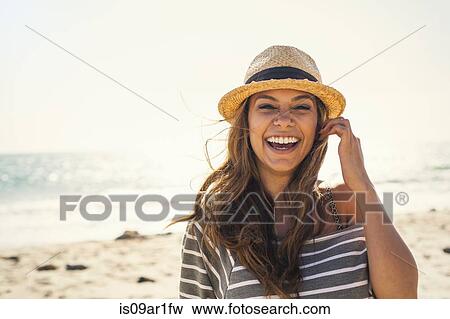 Stock Photo - Woman posing on beach. Fotosearch