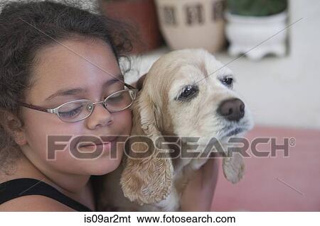 "Young girl hugging dog, close-up" View Large Photo Image Stock Photograph - "Young girl hugging dog, close-up". Fotosearch