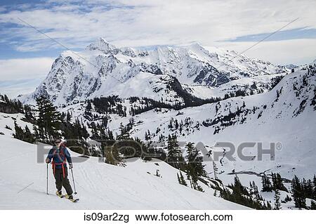 "Young male skier moving along mountainside, Mount Baker, Washington, USA" View Large Photo Image Stock Image - "Young male skier moving along mountainside, Mount Baker, Washington, USA". Fotosearch