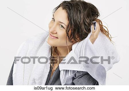 Young woman towel drying hair View Large Photo Image Stock Image - Young woman towel drying hair. Fotosearch