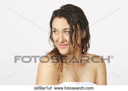 Young woman with wet hair wearing towel View Large Photo Image Stock Image - Young woman with wet hair wearing towel. Fotosearch