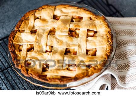 Apple pie with latticed pastry on kitchen counter View Large Photo Image Stock Image - Apple pie with latticed pastry on kitchen counter. Fotosearch