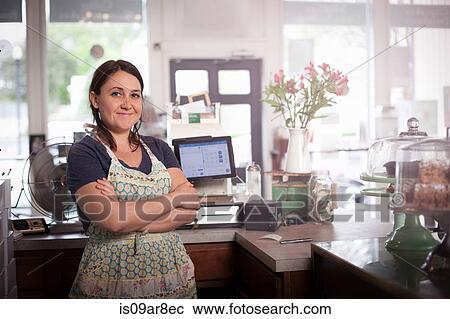 Bakery owner with arms crossed behind counter View Large Photo Image Stock Image - Bakery owner with arms crossed behind counter. Fotosearch