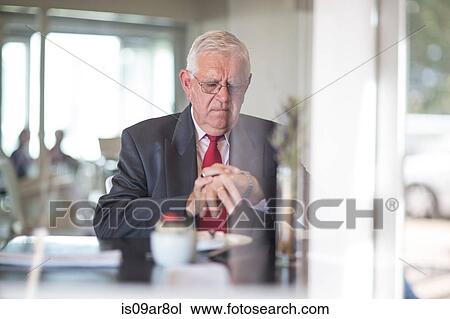 Business man waiting for business lunch appointment View Large Photo Image Stock Image - Business man waiting for business lunch appointment. Fotosearch