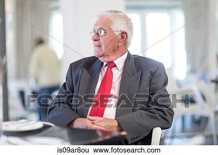 Business man waiting for business lunch appointment View Large Photo Image Stock Photograph - Business man waiting for business lunch appointment. Fotosearch