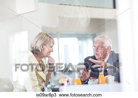 Stock Image - Business people at business lunch. Fotosearch