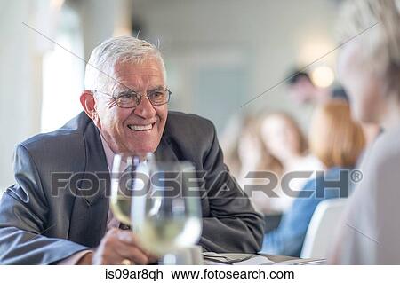 Stock Image - Business people at business lunch. Fotosearch