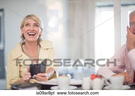 Business people at business lunch View Large Photo Image Stock Photograph - Business people at business lunch. Fotosearch