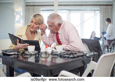 Stock Photography - Business people at business lunch. Fotosearch