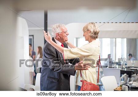 Business people greeting each other at business lunch appointment View Large Photo Image Stock Photo - Business people greeting each other at business lunch appointment. Fotosearch