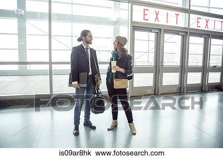 Stock Image - Business people having coffee on the go, New York, USA. Fotosearch