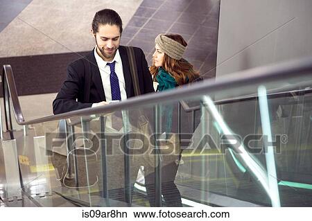 Business people on business trip going up escalator, New York, USA View Large Photo Image Picture - Business people on business trip going up escalator, New York, USA. Fotosearch