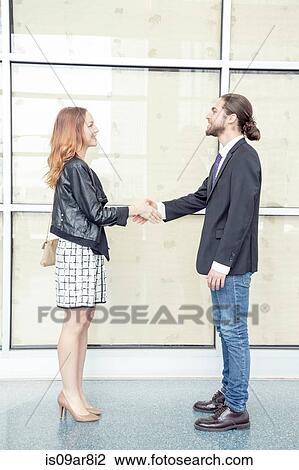 Stock Image - Business people shaking hands. Fotosearch
