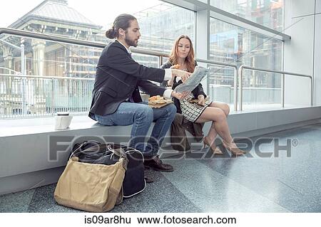 Business people sharing information from newspapers, New York, USA View Large Photo Image Stock Photograph - Business people sharing information from newspapers, New York, USA. Fotosearch