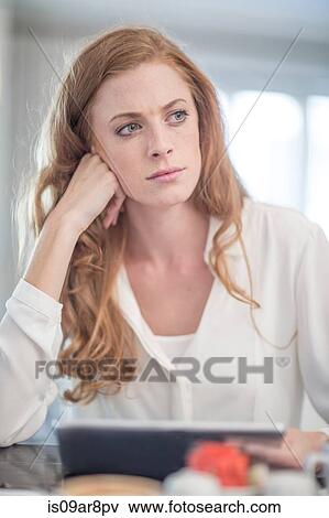 Stock Photo - Business woman waiting for business lunch appointment. Fotosearch