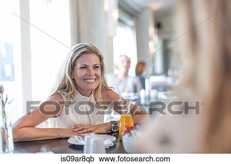 Stock Image - Business women at business lunch. Fotosearch