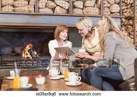 Stock Photograph - Business women at business lunch. Fotosearch