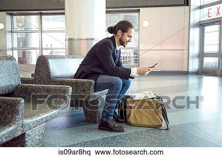 Businessman on business trip using digital tablet, New York, USA View Large Photo Image Stock Photography - Businessman on business trip using digital tablet, New York, USA. Fotosearch