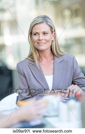 Businesswoman at coffee break on hotel terrace View Large Photo Image Stock Image - Businesswoman at coffee break on hotel terrace. Fotosearch