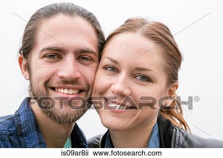 Stock Image - Close up portrait of couple. Fotosearch