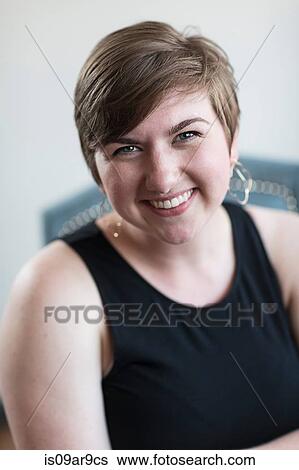 Close up portrait of smiling young woman with short brown hair View Large Photo Image Stock Photograph - Close up portrait of smiling young woman with short brown hair. Fotosearch