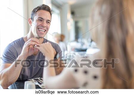 Stock Image - Couple at lunch in restaurant. Fotosearch