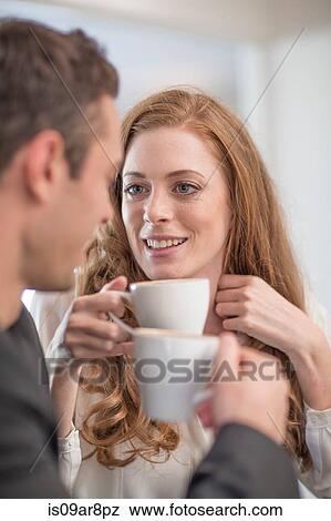 Couple having coffee View Large Photo Image Stock Photo - Couple having coffee. Fotosearch