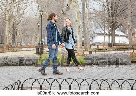 Stock Image - Couple in park, New York, New York, USA. Fotosearch