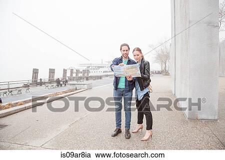 Couple map-reading, New York, USA View Large Photo Image Stock Image - Couple map-reading, New York, USA. Fotosearch