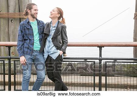 Couple on seafront, New York, New York, USA View Large Photo Image Stock Image - Couple on seafront, New York, New York, USA. Fotosearch