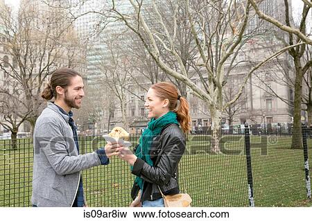 Couple sharing lunch, New York, New York, USA View Large Photo Image Stock Photo - Couple sharing lunch, New York, New York, USA. Fotosearch