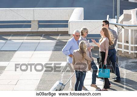 Five adults talking outdoors, high angle View Large Photo Image Stock Image - Five adults talking outdoors, high angle. Fotosearch