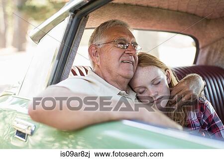 Grandfather and granddaughter sitting in back seat of car, granddaughter sleeping View Large Photo Image Stock Image - Grandfather and granddaughter sitting in back seat of car, granddaughter sleeping. Fotosearch