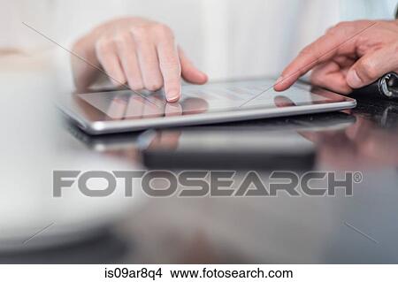 Hand of business person using digital tablet View Large Photo Image Picture - Hand of business person using digital tablet. Fotosearch