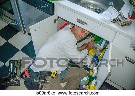 Handyman fixing kitchen sink pipe View Large Photo Image Stock Image - Handyman fixing kitchen sink pipe. Fotosearch