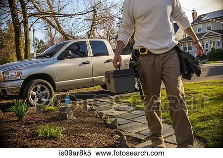 Stock Photography - Handyman going to house call. Fotosearch