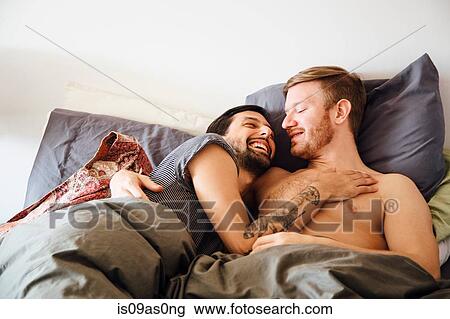 Male couple in bed, embracing, face to face View Large Photo Image Stock Image - Male couple in bed, embracing, face to face. Fotosearch