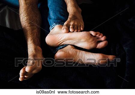 Male couple lying together, focus on feet View Large Photo Image Stock Image - Male couple lying together, focus on feet. Fotosearch