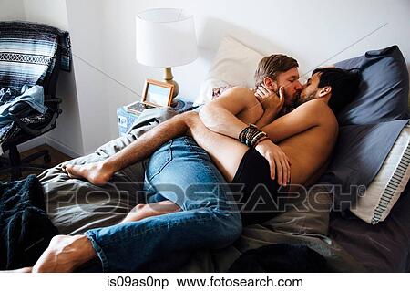 Male couple, partially dressed, lying on bed, kissing View Large Photo Image Stock Photography - Male couple, partially dressed, lying on bed, kissing. Fotosearch