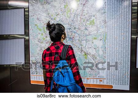 Mid adult woman looking at street map, Milan, Italy View Large Photo Image Stock Image - Mid adult woman looking at street map, Milan, Italy. Fotosearch