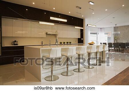 Modern kitchen with island inside luxurious home, Quebec, Canada View Large Photo Image Stock Image - Modern kitchen with island inside luxurious home, Quebec, Canada. Fotosearch
